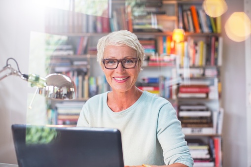 Woman researching on computer.